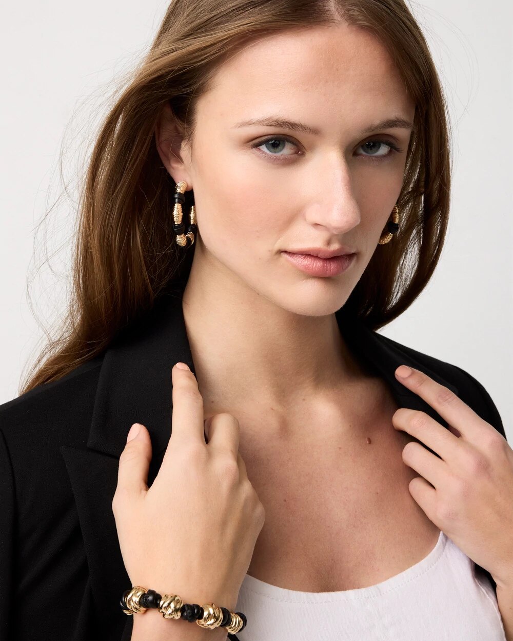 WHBM_ER20Gld20Sculpt20Knot20Hoop_570409893_TAN000932_OF_MAIN-1.jpeg