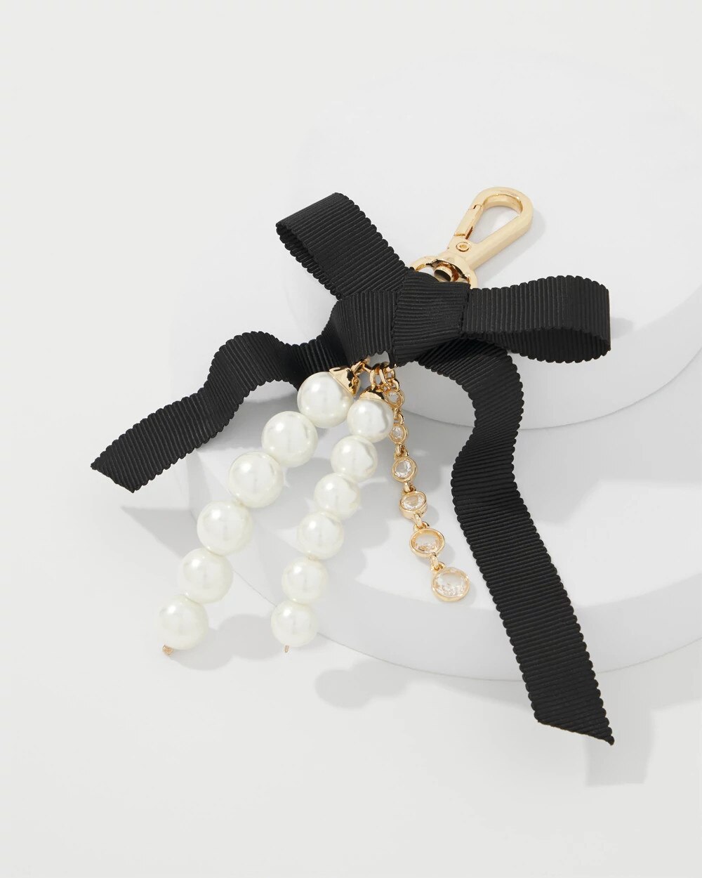 WHBM_Gld20Pearl20Bow20Bag20Charm_570407781_TAN000932_TT_ALT201.jpeg