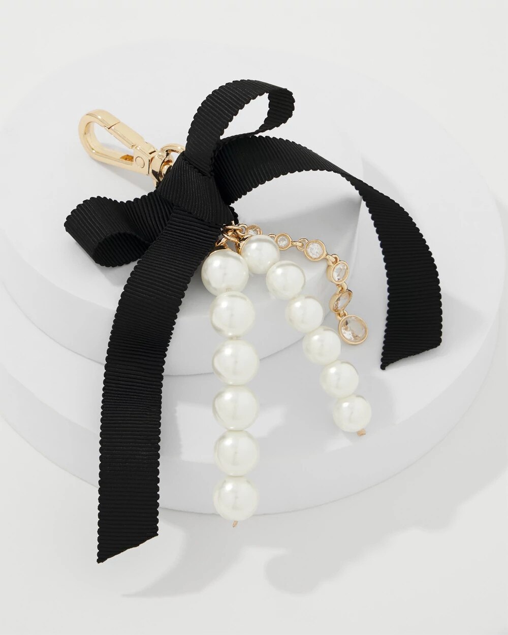 WHBM_Gld20Pearl20Bow20Bag20Charm_570407781_TAN000932_TT_ALT202.jpeg